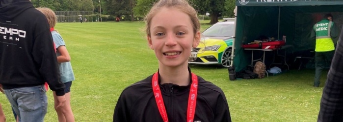 Exwick Heights pupil Polly with her medal.